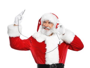 Photo of Santa Claus listening to Christmas music on white background