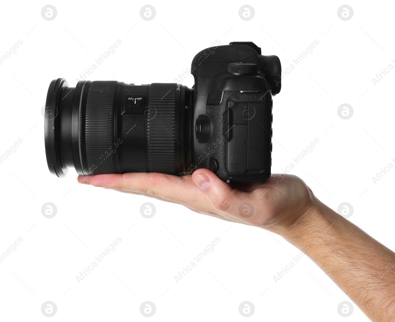 Photo of Photographer holding modern camera on white background, closeup