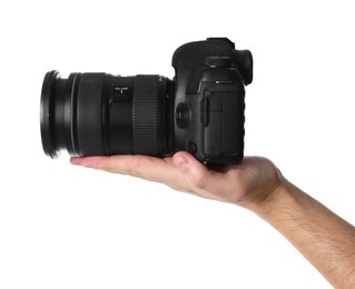 Photo of Photographer holding modern camera on white background, closeup