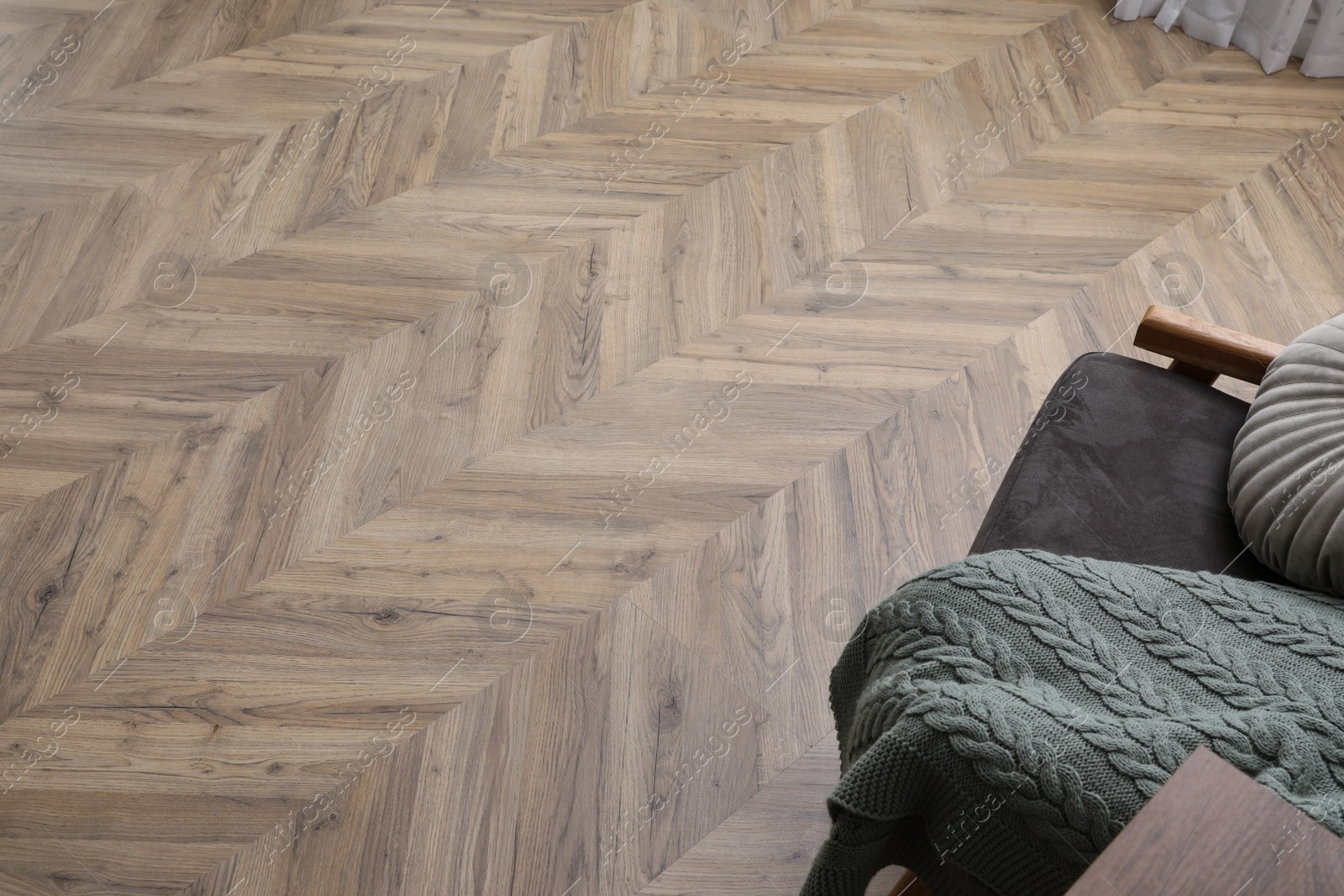 Photo of Parquet flooring in living room, above view. Modern material
