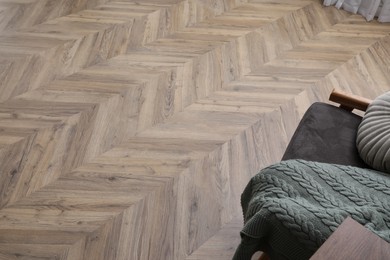 Photo of Parquet flooring in living room, above view. Modern material