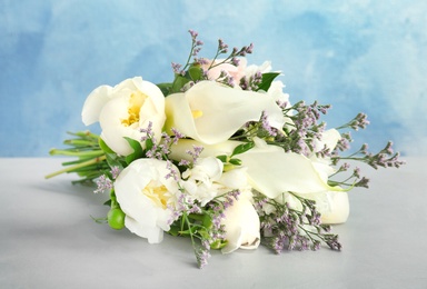 Photo of Bouquet of beautiful fragrant flowers on table