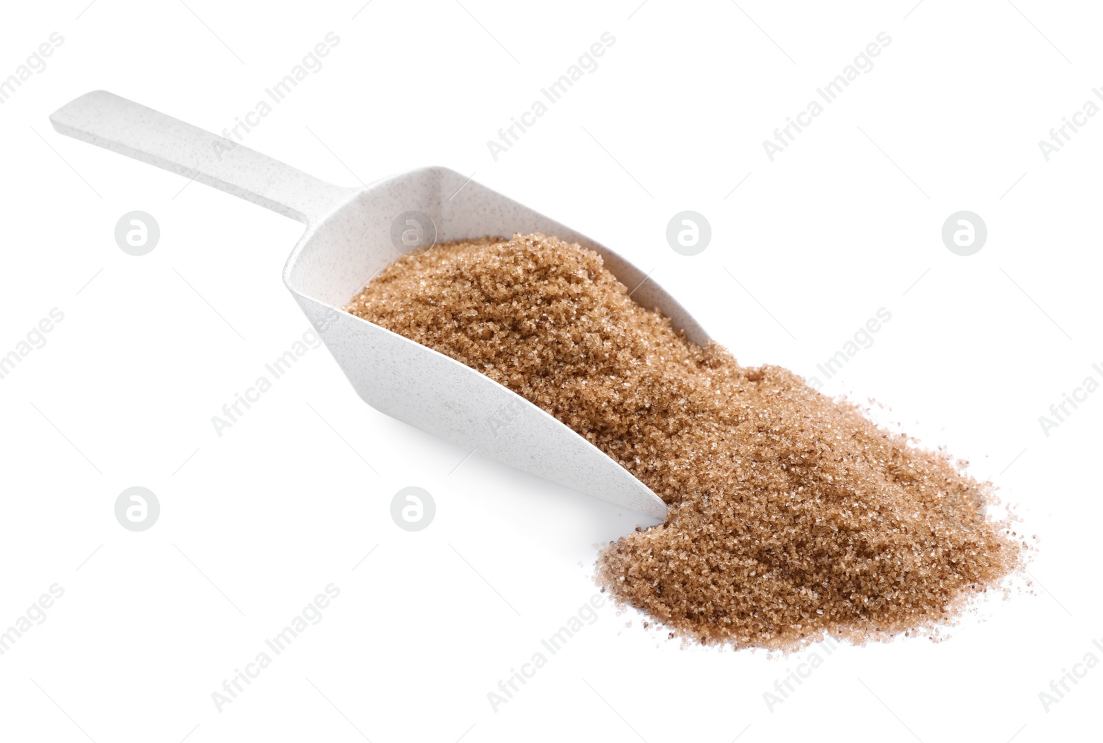 Photo of Brown salt and scoop on white background