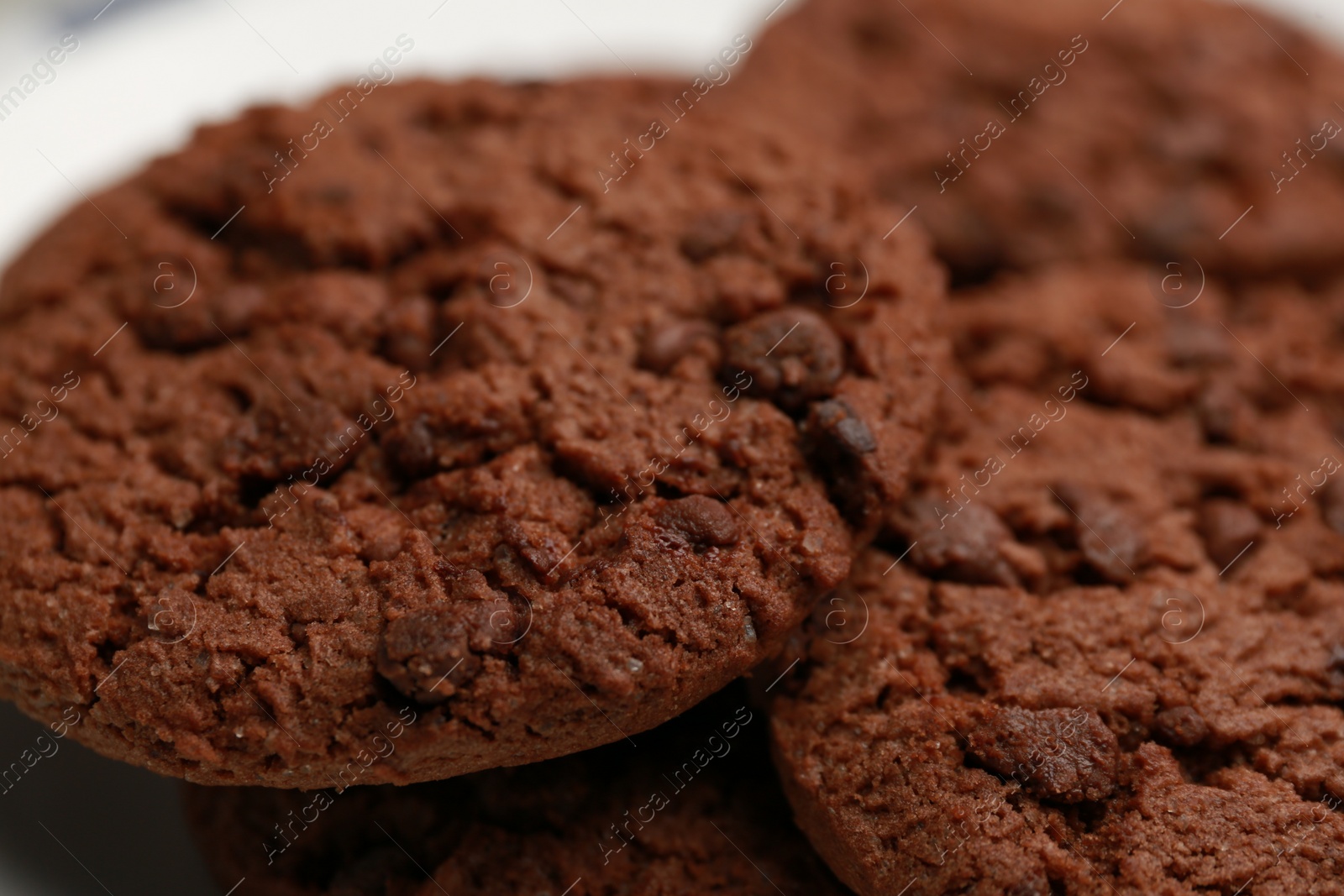 Photo of Closeup view of delicious chocolate chip cookies