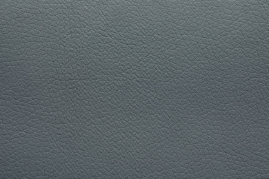 Photo of Texture of grey leather as background, closeup