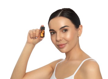 Photo of Young woman with bottle of essential oil on white background