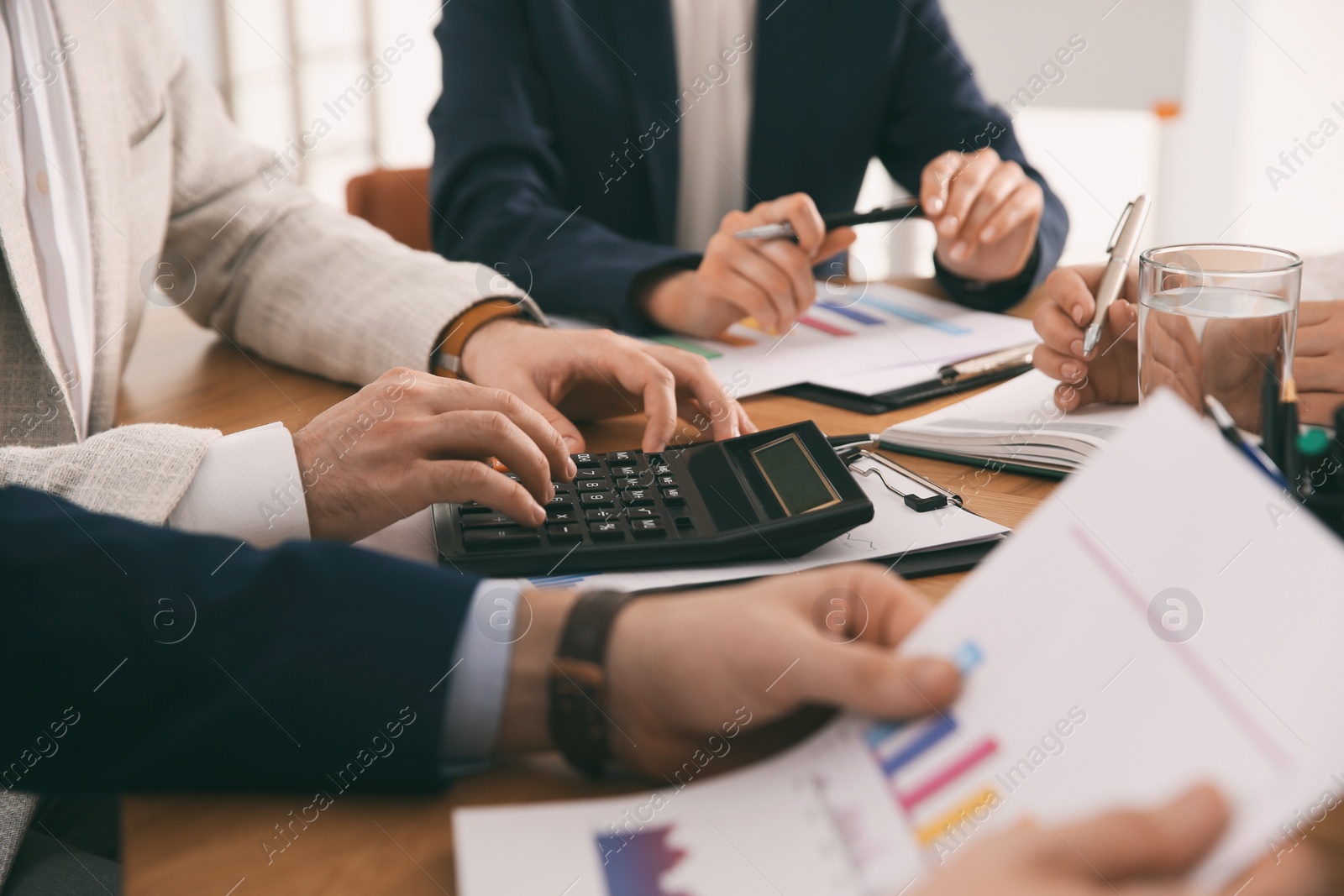 Photo of Businesspeople having meeting in office, closeup. Management consulting