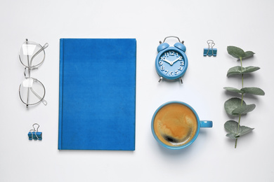 Photo of Flat lay composition inspired by color of the year 2020  (Classic blue) on white background