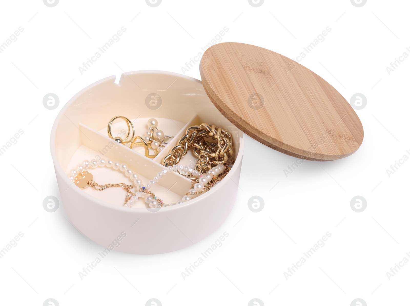 Photo of Jewelry box with different accessories isolated on white
