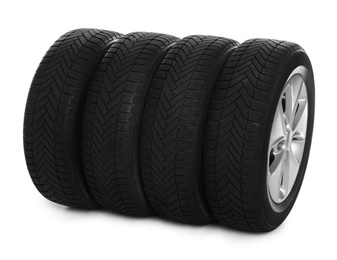 Set of wheels with winter tires on white background