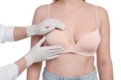 Mammologist checking woman's breast on white background, closeup