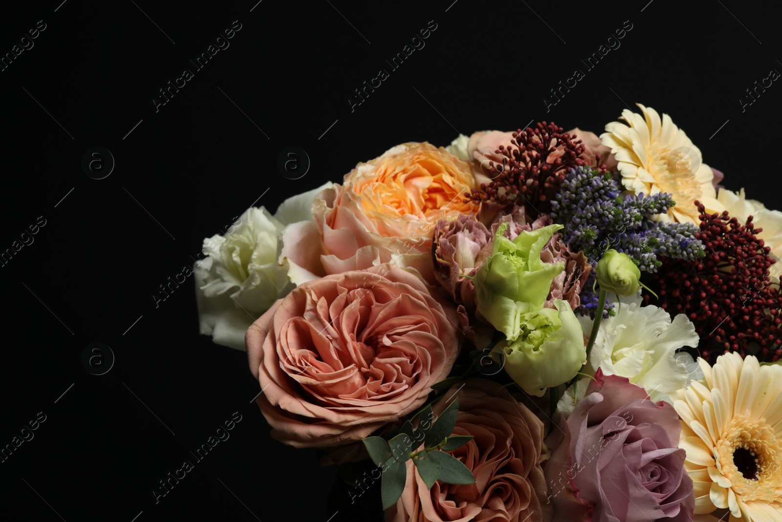 Photo of Bouquet of beautiful flowers on black background