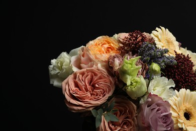 Photo of Bouquet of beautiful flowers on black background