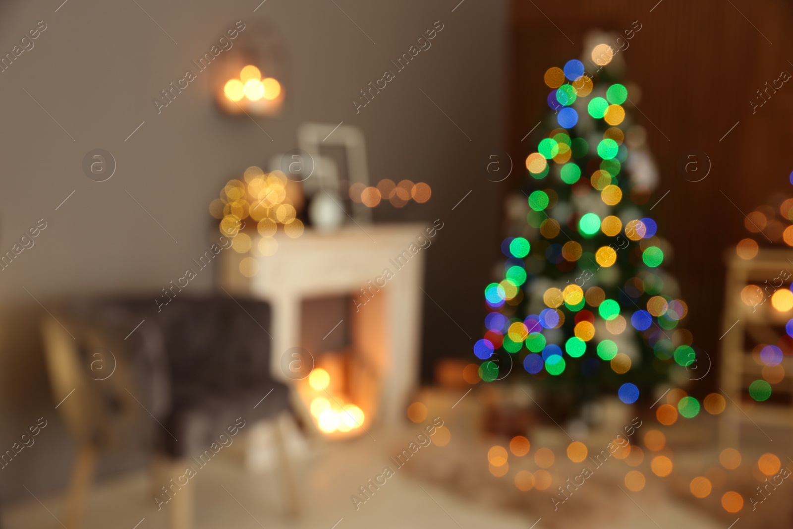 Photo of Blurred stylish room interior with Christmas tree and decorative fireplace