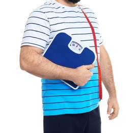 Overweight man with scale on white background