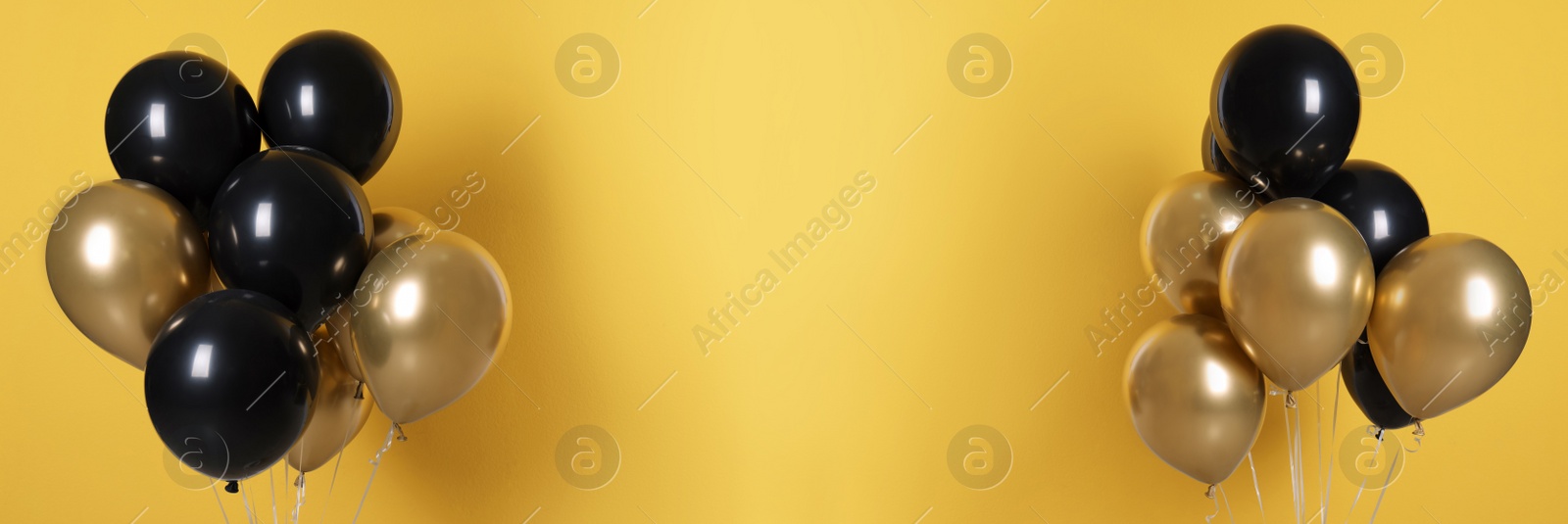 Image of Set of color balloons on yellow background, space for text. Banner design