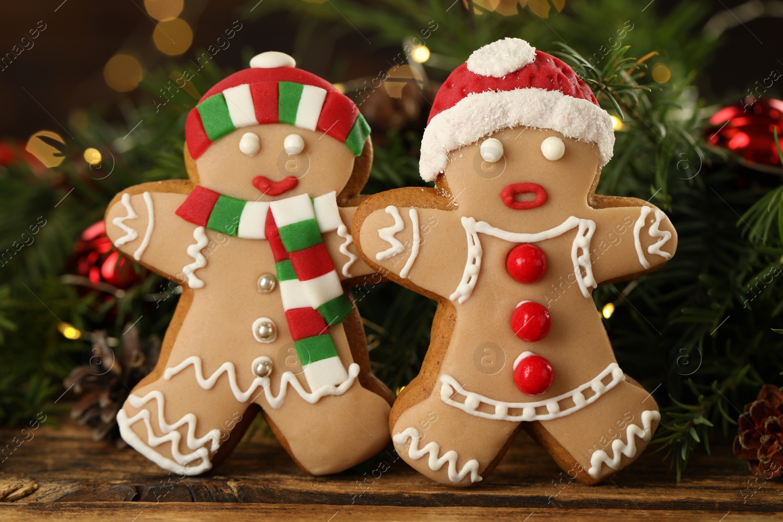 Photo of Delicious homemade Christmas cookies and festive decor on wooden table