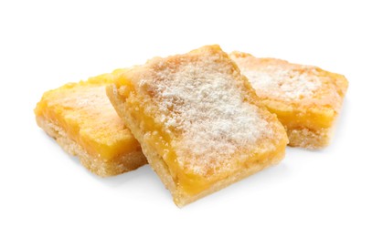 Photo of Tasty lemon bars with powdered sugar isolated on white