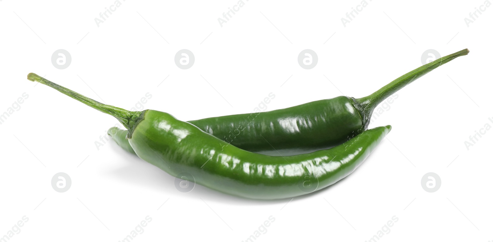 Photo of Green hot chili peppers on white background