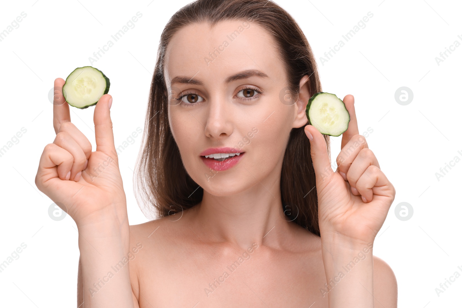 Photo of Beautiful woman with pieces of cucumber on white background