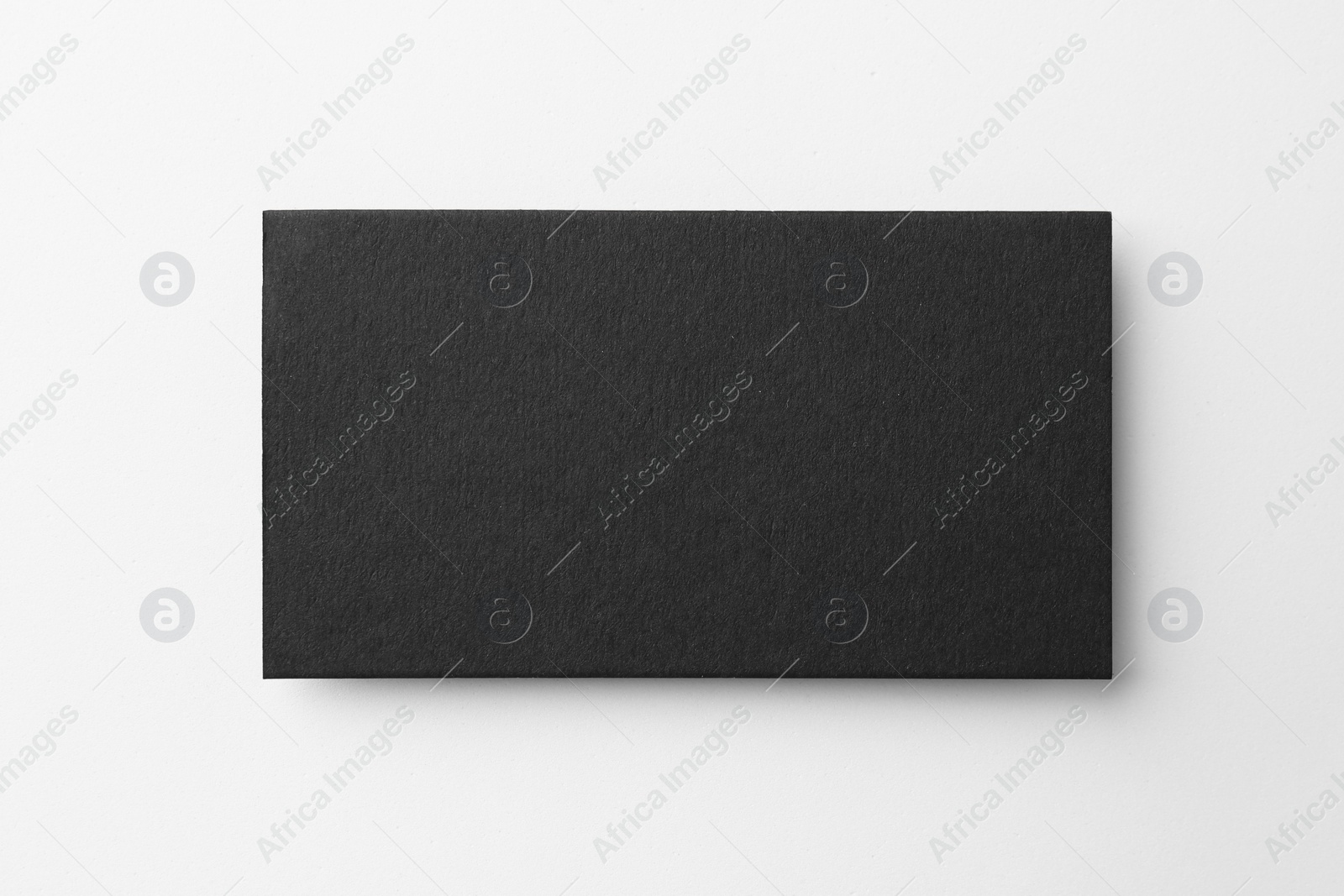 Photo of Blank black business card on white background, top view. Mockup for design