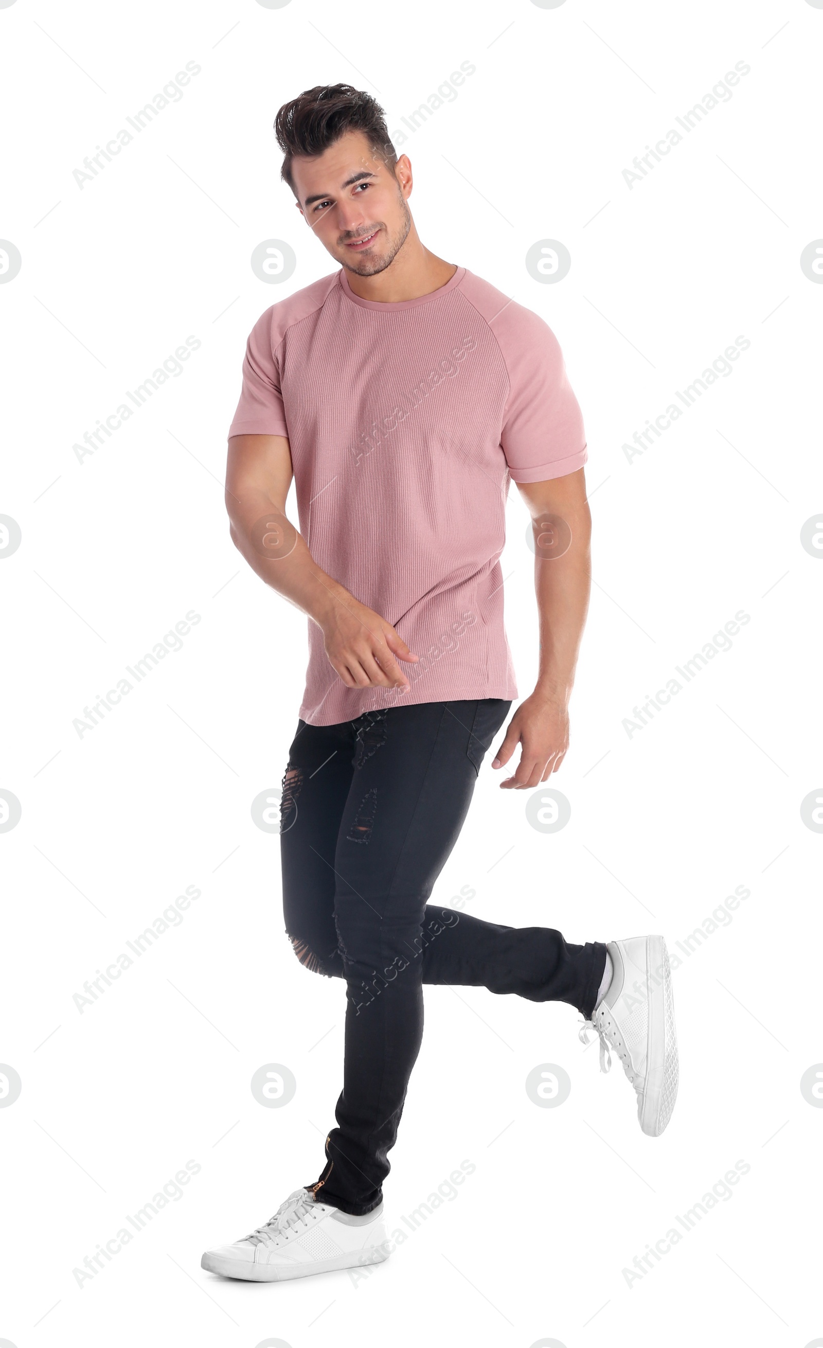 Photo of Young man in stylish jeans on white background