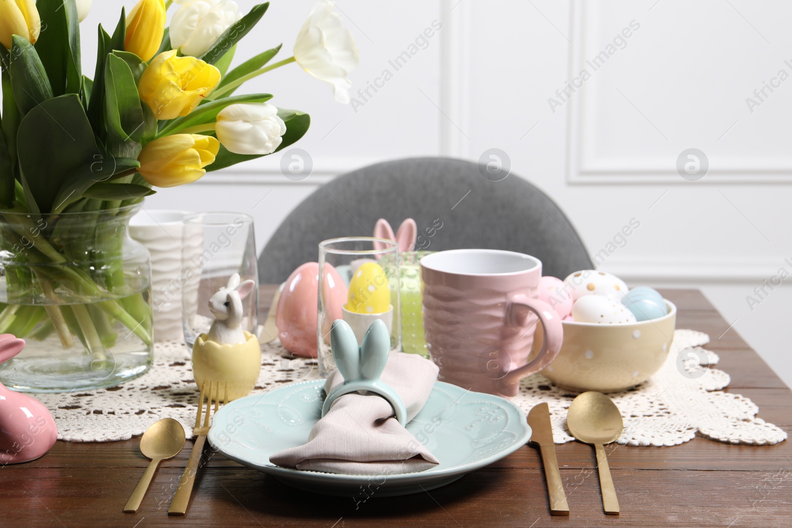 Photo of Festive table setting with beautiful flowers. Easter celebration