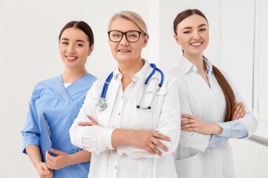 Portrait of medical doctors wearing uniforms indoors