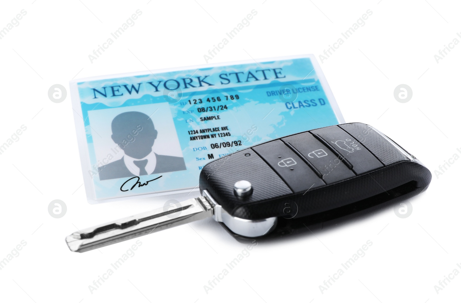 Photo of American driving license and car key on white background