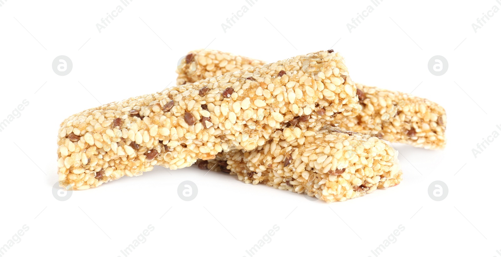 Photo of Tasty sesame seed bars isolated on white