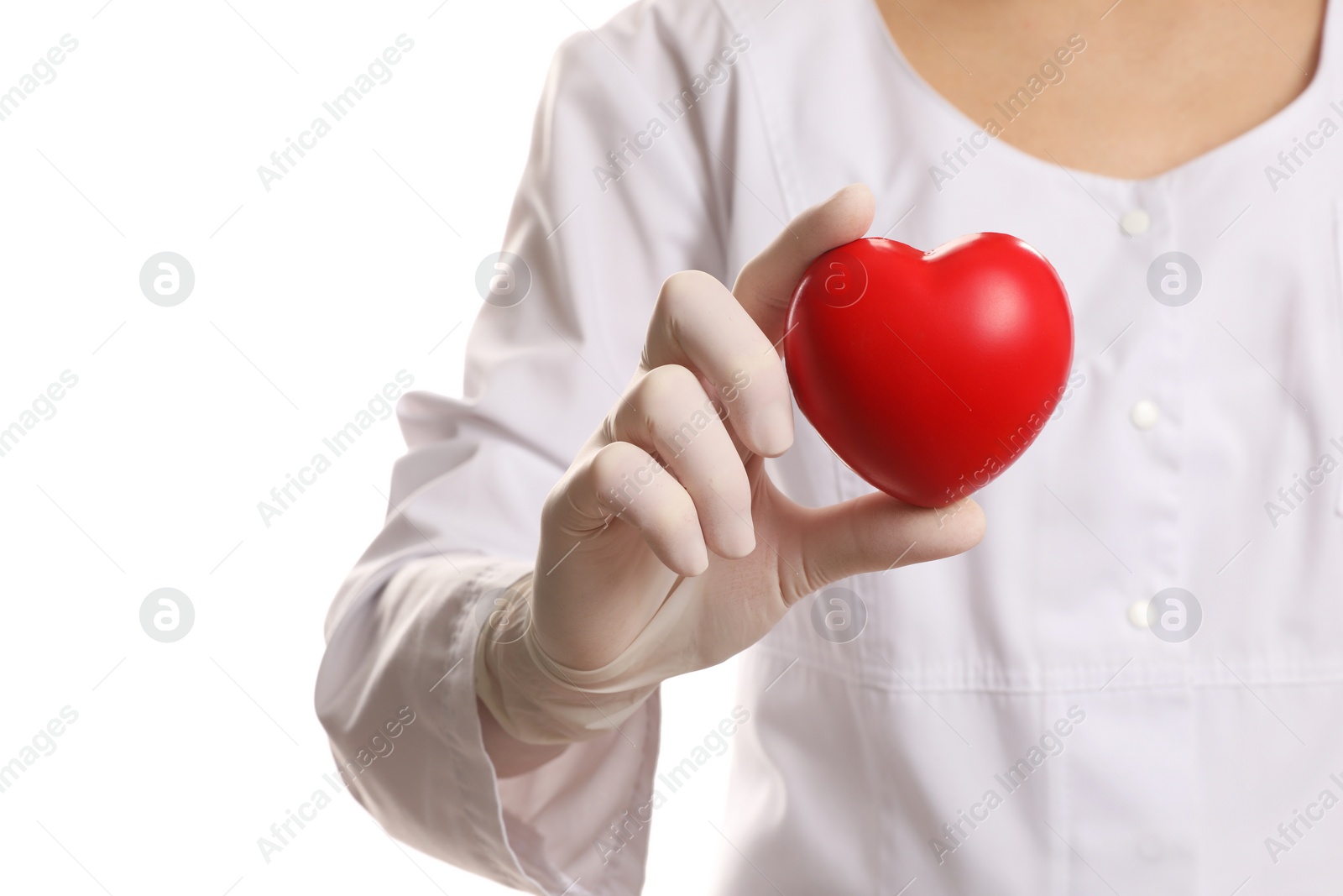 Photo of Doctor in medical glove holding red heart on white background, selective focus