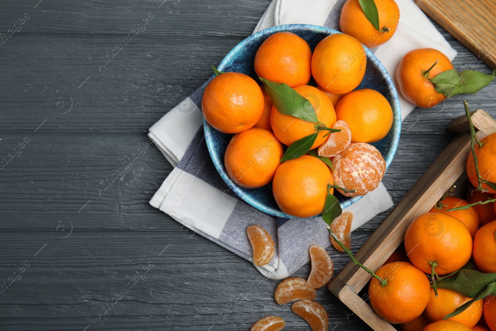 Photo of Flat lay composition with fresh ripe tangerines and space for text on wooden background