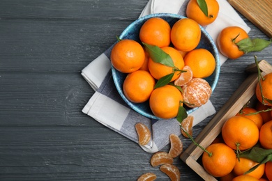 Photo of Flat lay composition with fresh ripe tangerines and space for text on wooden background