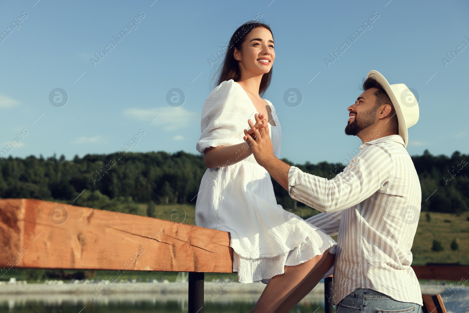 Photo of Romantic date. Beautiful couple spending time together outdoors, space for text