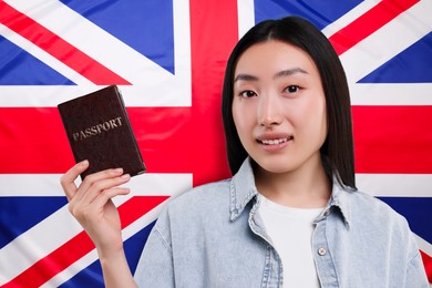 Immigration. Woman with passport against national flag of United Kingdom