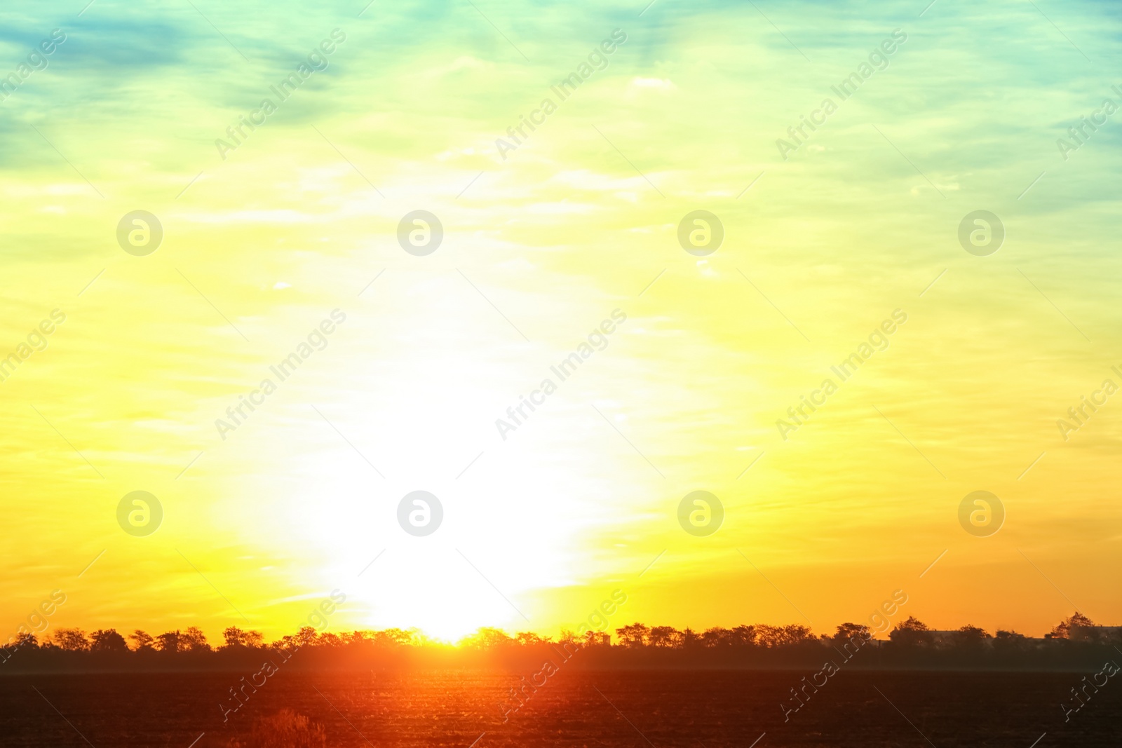 Photo of Picturesque view of beautiful sky lit by setting sun