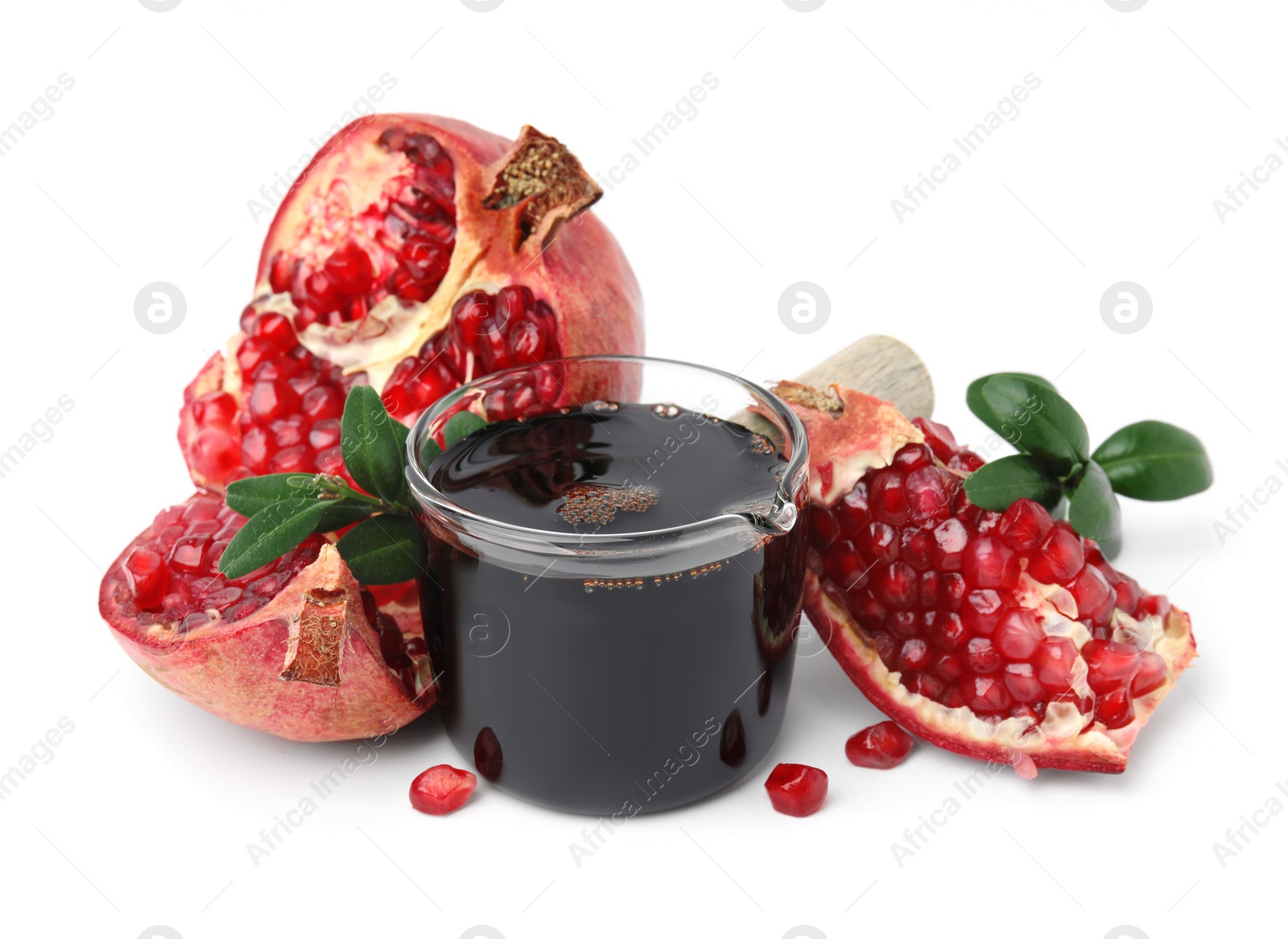 Photo of Tasty pomegranate sauce, fruits and branches isolated on white