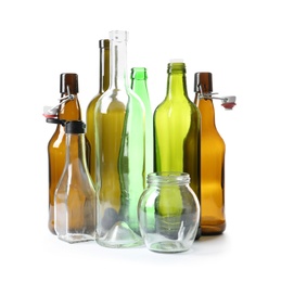 Empty glass bottles and jar on white background. Recycling problem