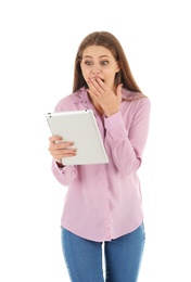 Photo of Emotional young woman with tablet celebrating victory on white background