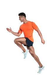 Photo of Handsome young man running on white background