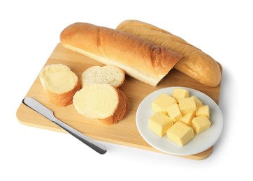 Photo of Whole and cut baguettes with fresh butter on white background