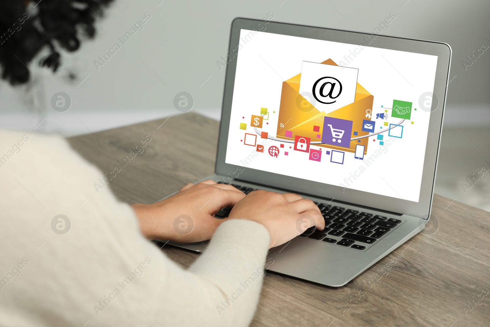 Image of Email marketing. Woman using laptop at table, closeup