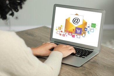 Email marketing. Woman using laptop at table, closeup