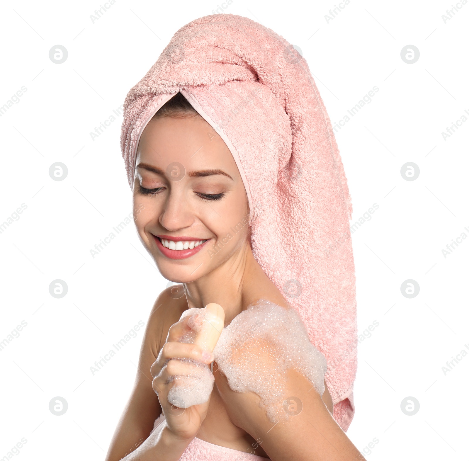 Image of Young woman washing body with soap bar on white background