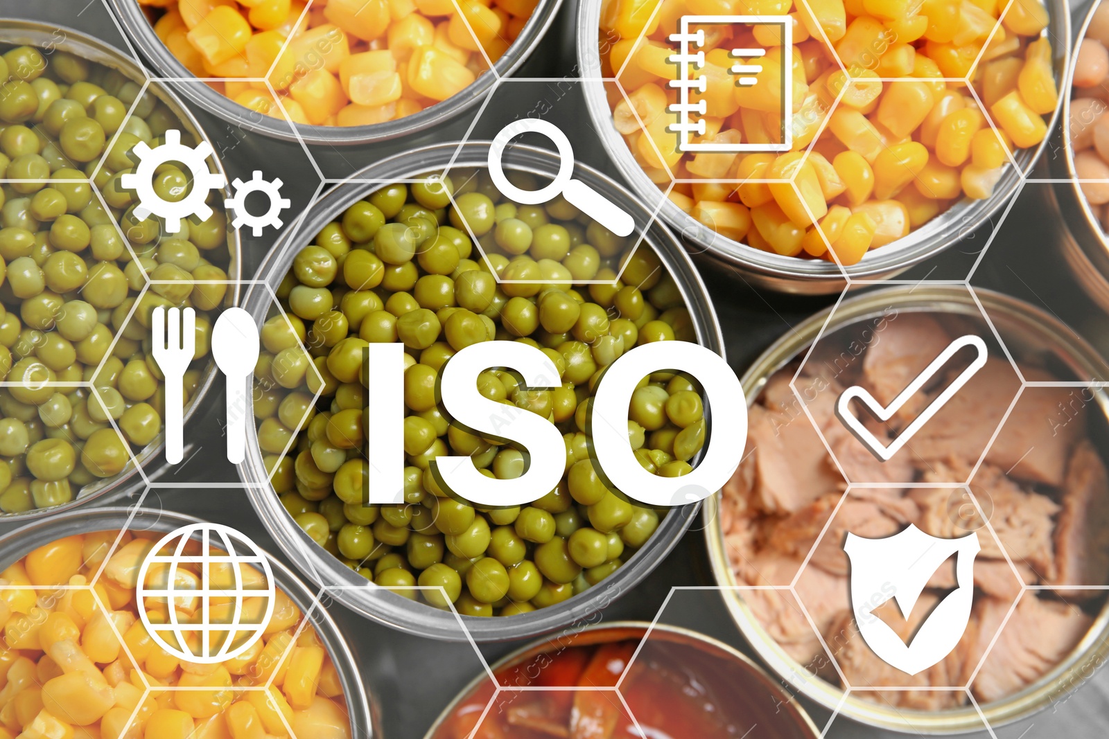 Image of ISO 22000 - Food safety management. Open tin cans of conserved products, top view