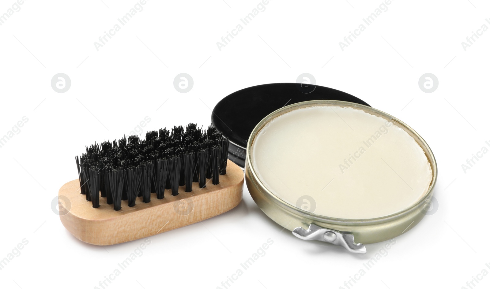 Photo of Wax polish with brush on white background. Shoe care accessories