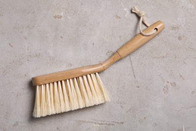 Photo of Cleaning brush on light grey table, top view