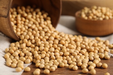 Natural soy beans on wooden table, closeup