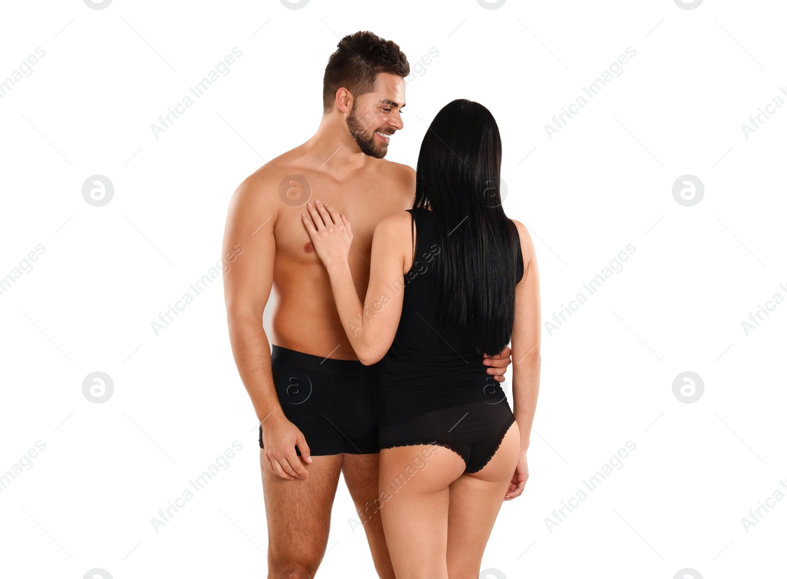 Photo of Young couple in black underwear on white background