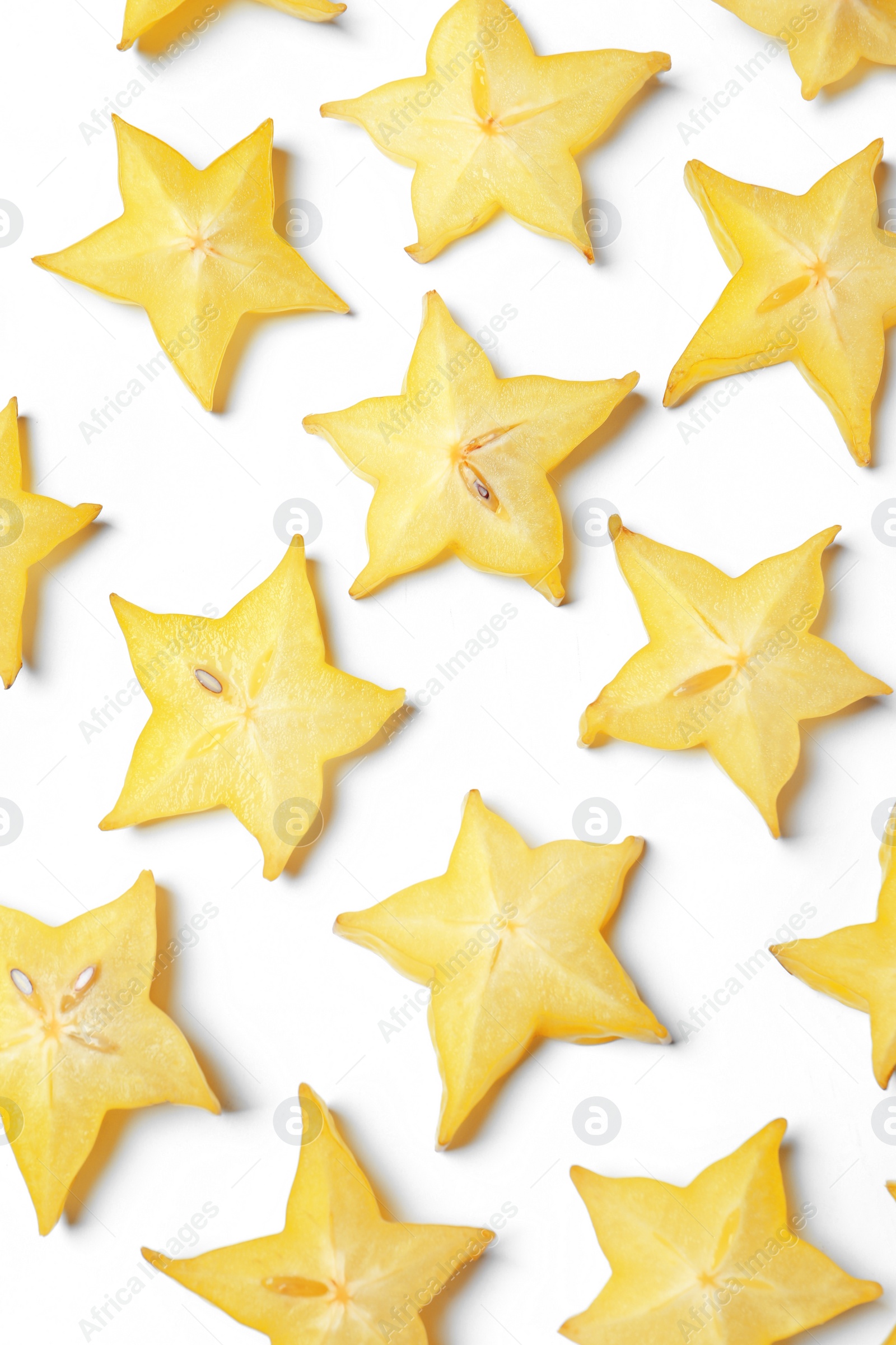 Photo of Slices of delicious carambola on white background, top view